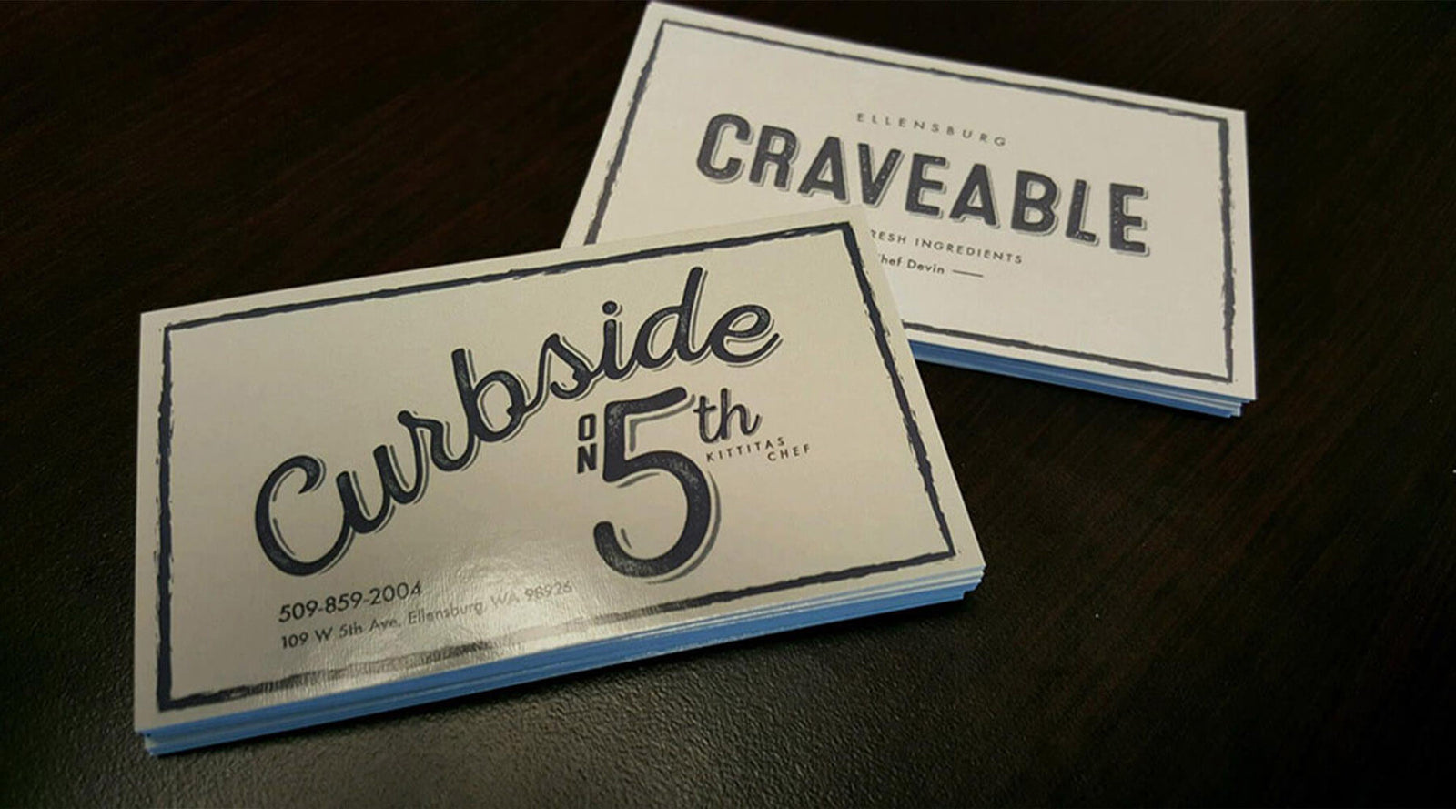 Two business cards illustrating the concept of collation, demonstrating what does collate mean when printing