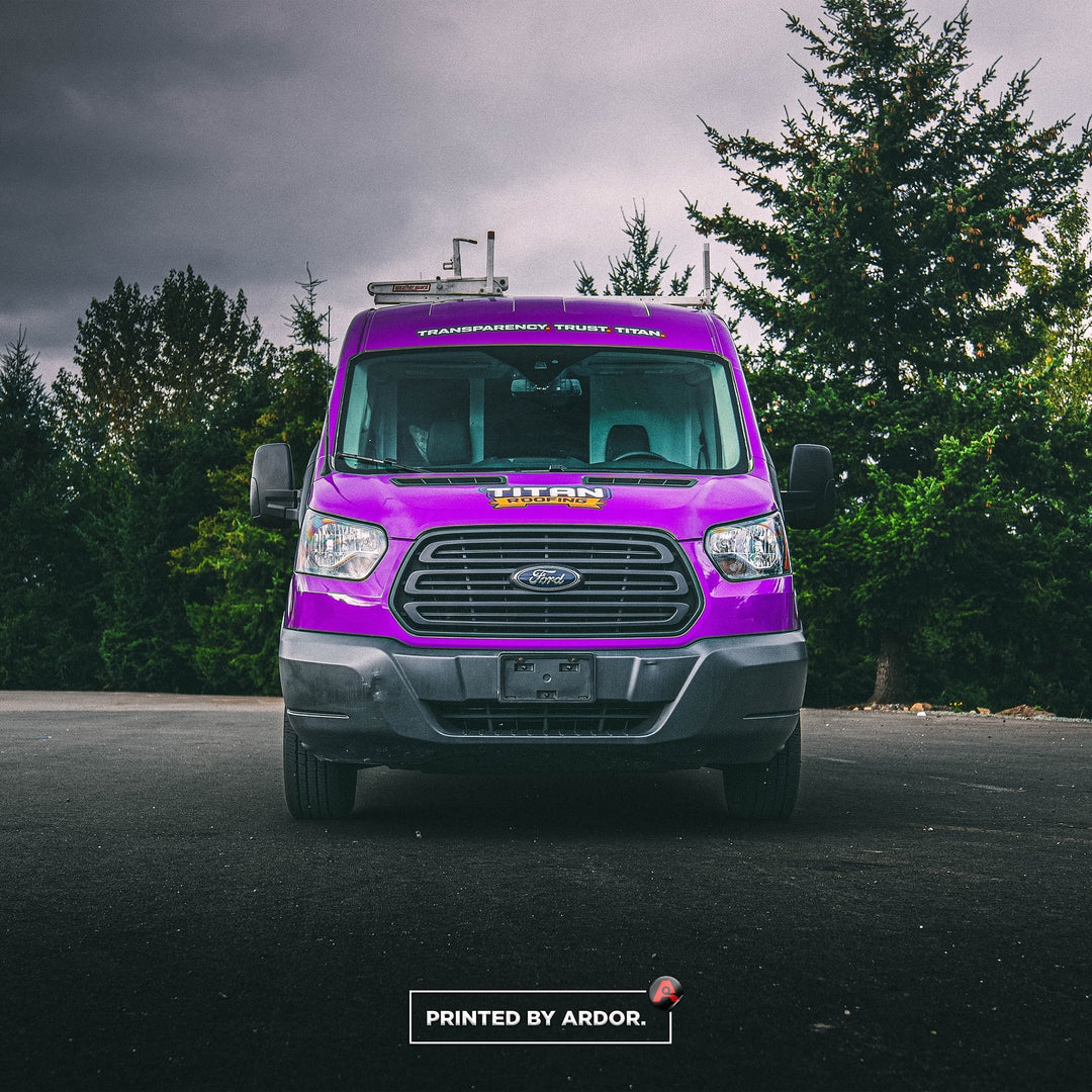 Front view of a purple vinyl car wrap on a Titan Roofing van by Ardor Printing in Seattle.