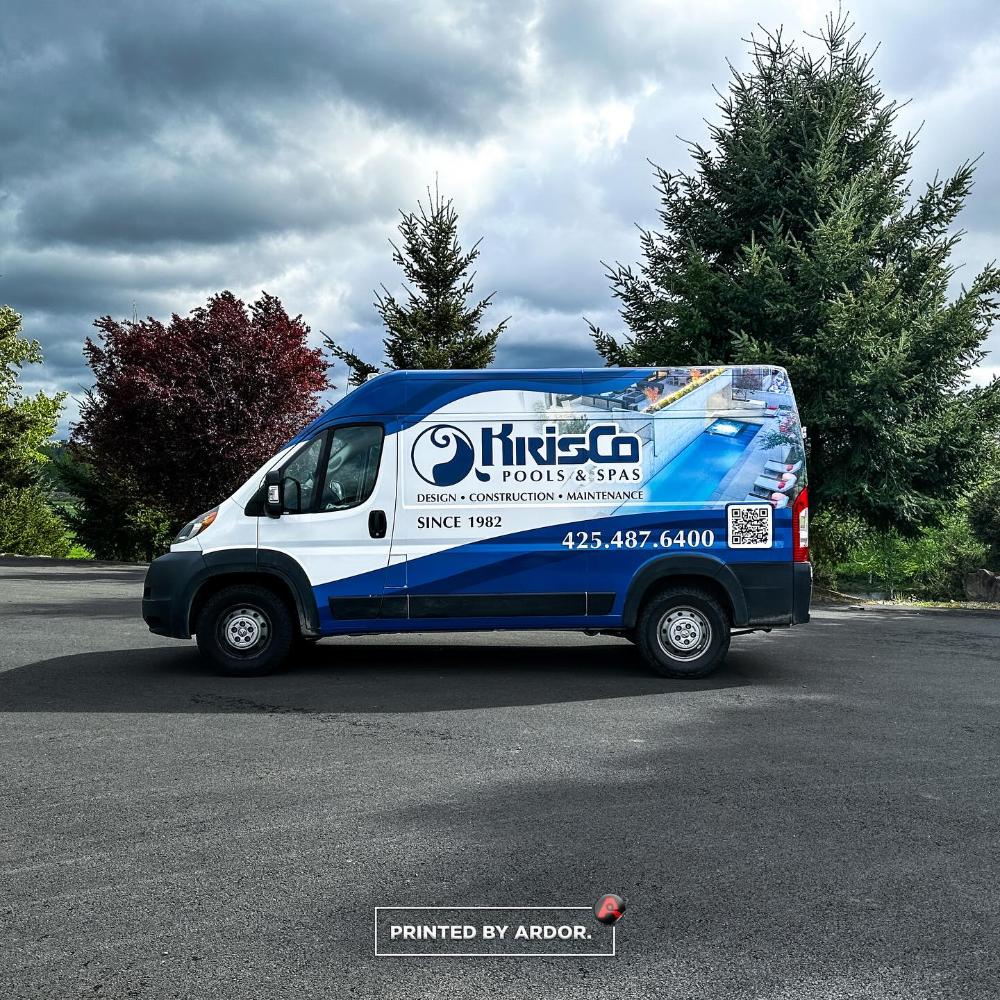 Side view of KrisCo Pools & Spas van wrap with blue branding, pool image, QR code, and phone number for pool services.