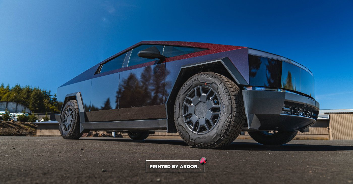 Up Close Photo of a Tesla Cyber Truck with a full vinyl car wrap In KPMF Red/Black Iridescent film in Snohomish, WA