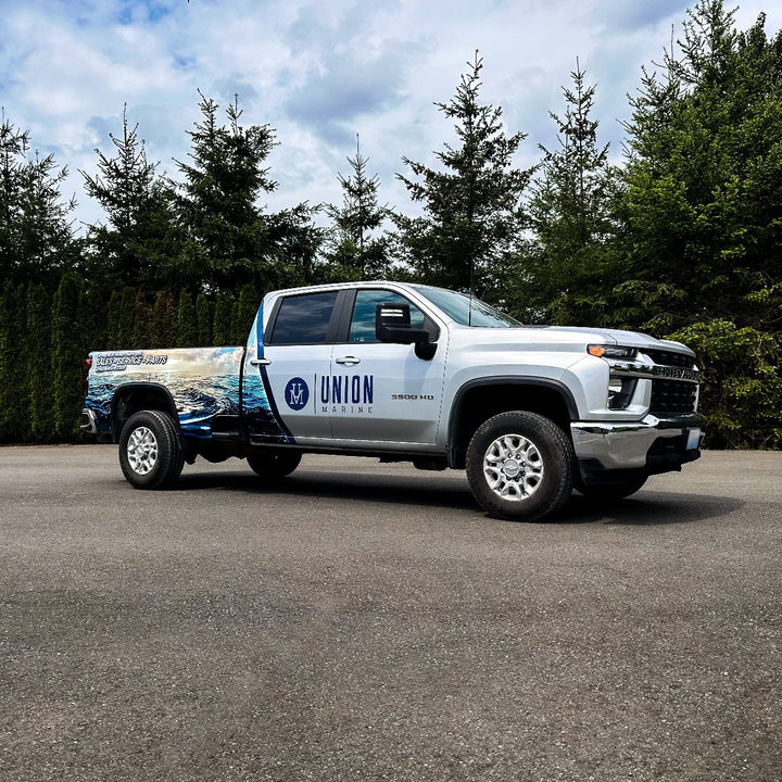 Side view of a Silverado truck wrap by Ardor Printing for Union Marine in Bellevue, WA