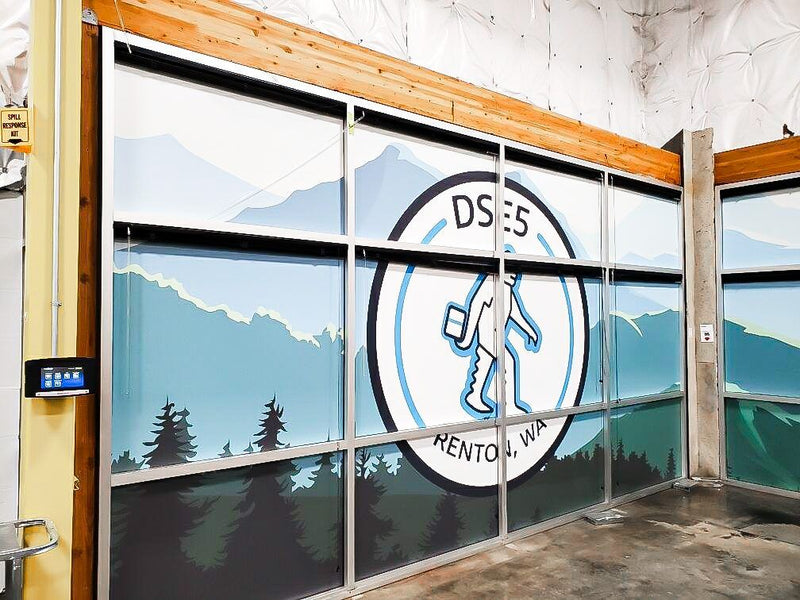 Mountain landscape window graphics covering interior glass at an Amazon delivery station, view 2 by Ardor Printing