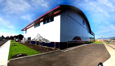 Exterior wall wrap on a curved commercial building by Ardor Printing
