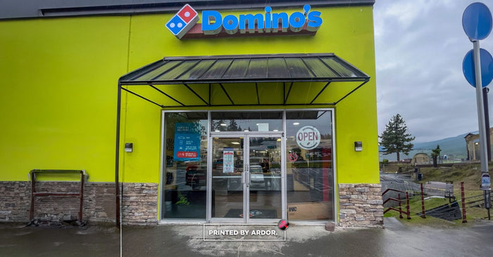 Domino's storefront windows before frosted privacy film