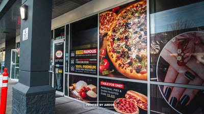Garlic Jim's pizza storefront with full-color perforated window graphics, view 2 by Ardor Printing