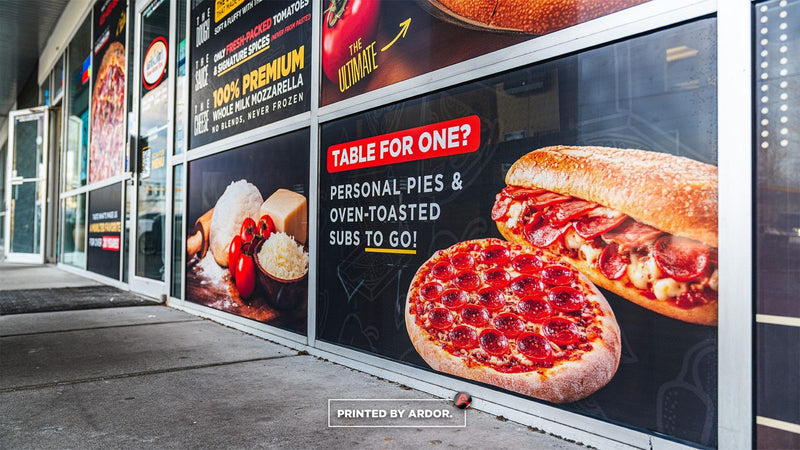 Garlic Jim's pizza storefront with full-color perforated window graphics, view 3 by Ardor Printing