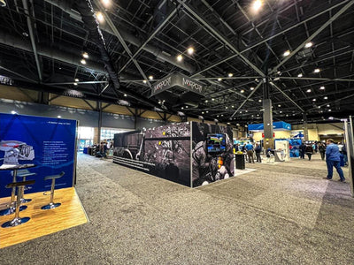 Marport island trade show booth with printed wall graphics and hanging sign by Ardor Printing, view 11