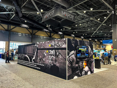 Marport island trade show booth with printed wall graphics and hanging sign by Ardor Printing, view 14