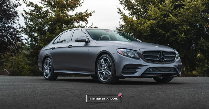 Mercedes-Benz E-Class sedan wrapped in satin grey vinyl by Ardor Printing, Greater Seattle