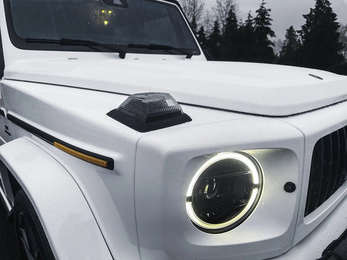 Close-up of the headlight and hood of a satin white wrapped Mercedes-Benz G-Wagon, Ardor Printing