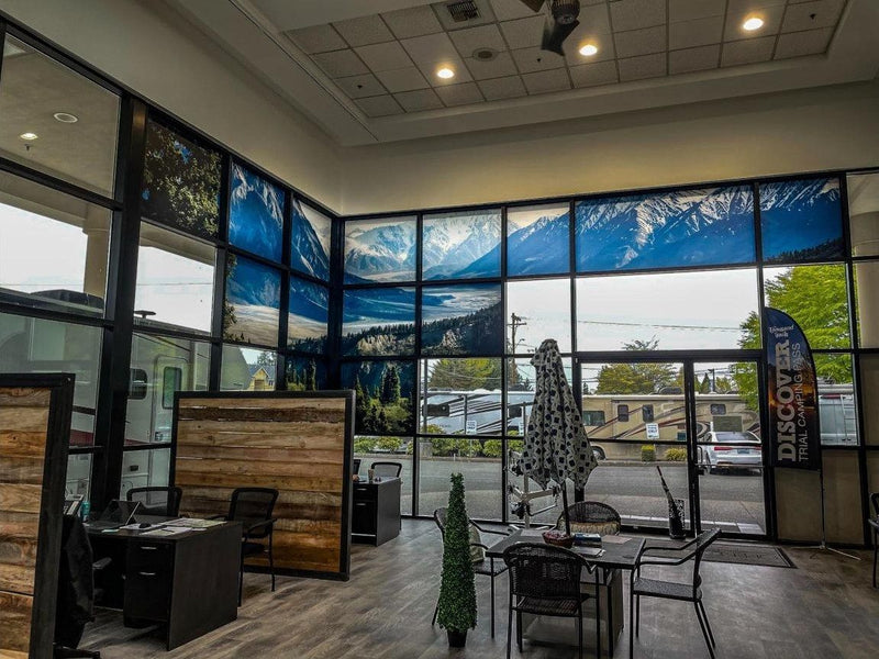 Floor-to-ceiling mountain scene window graphics in an RV dealership showroom by Ardor Printing