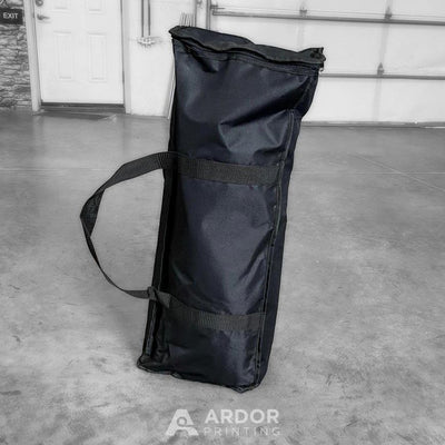 Portable tension fabric backdrop display packed in its carry bag by Ardor Printing