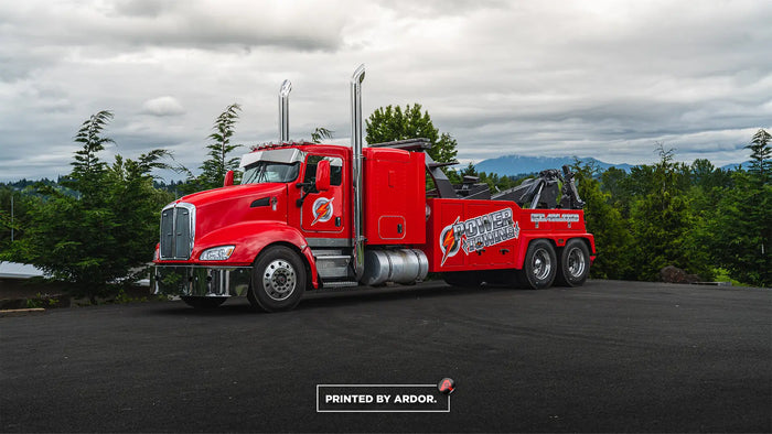 Red tow truck partial wrap and lettering