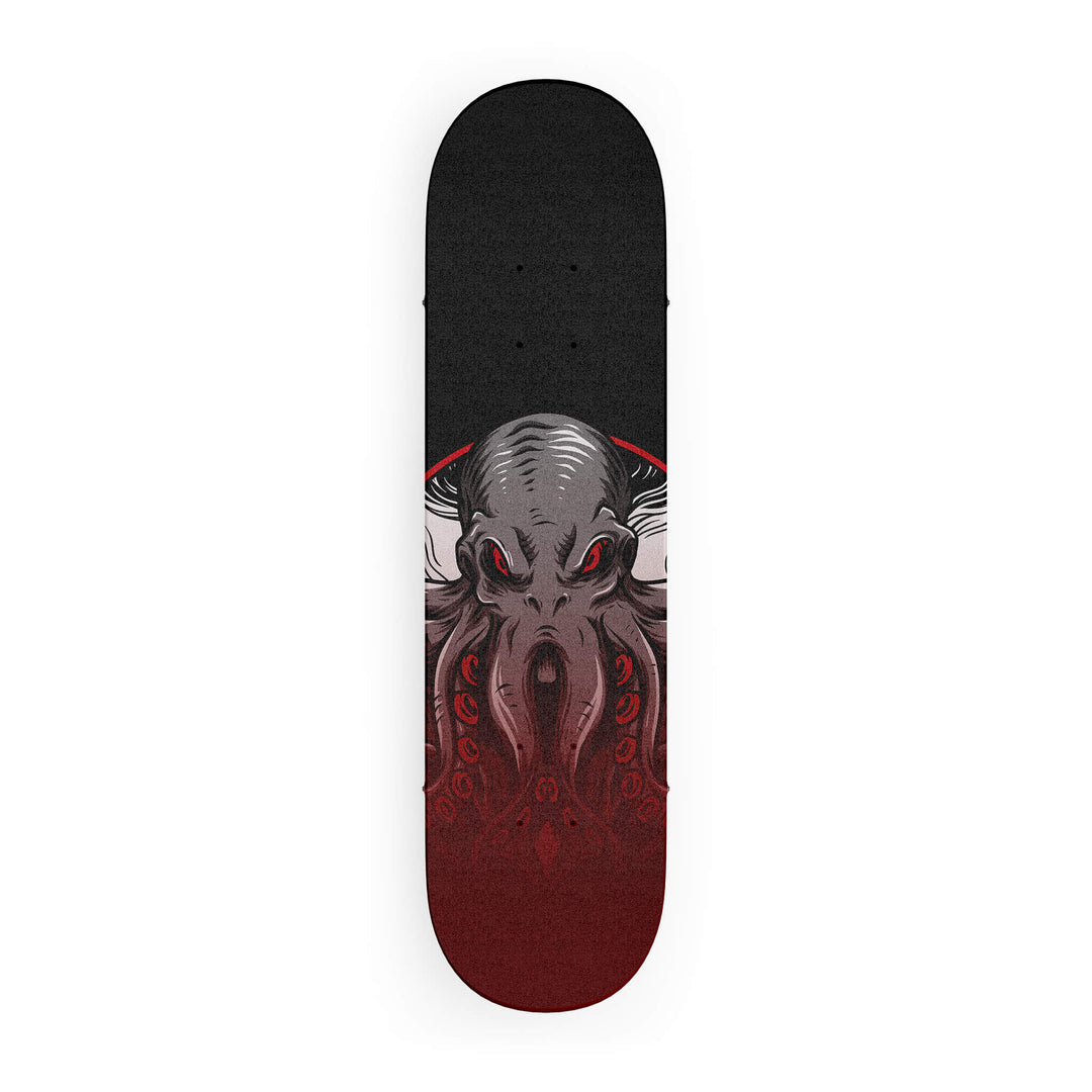 Top-down view of skateboard grip tape featuring majestic octopus in faded colors on a dark grey background.