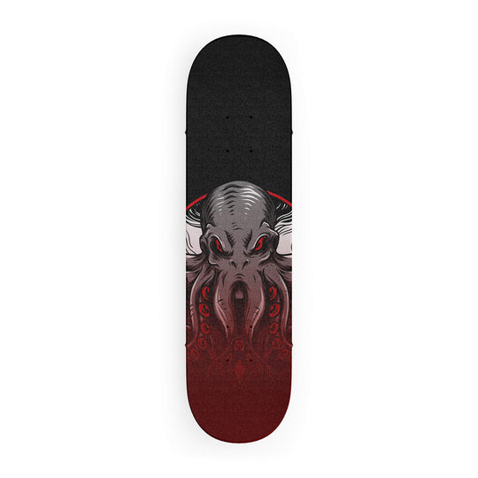 Top-down view of skateboard grip tape featuring majestic octopus in faded colors on a dark grey background.