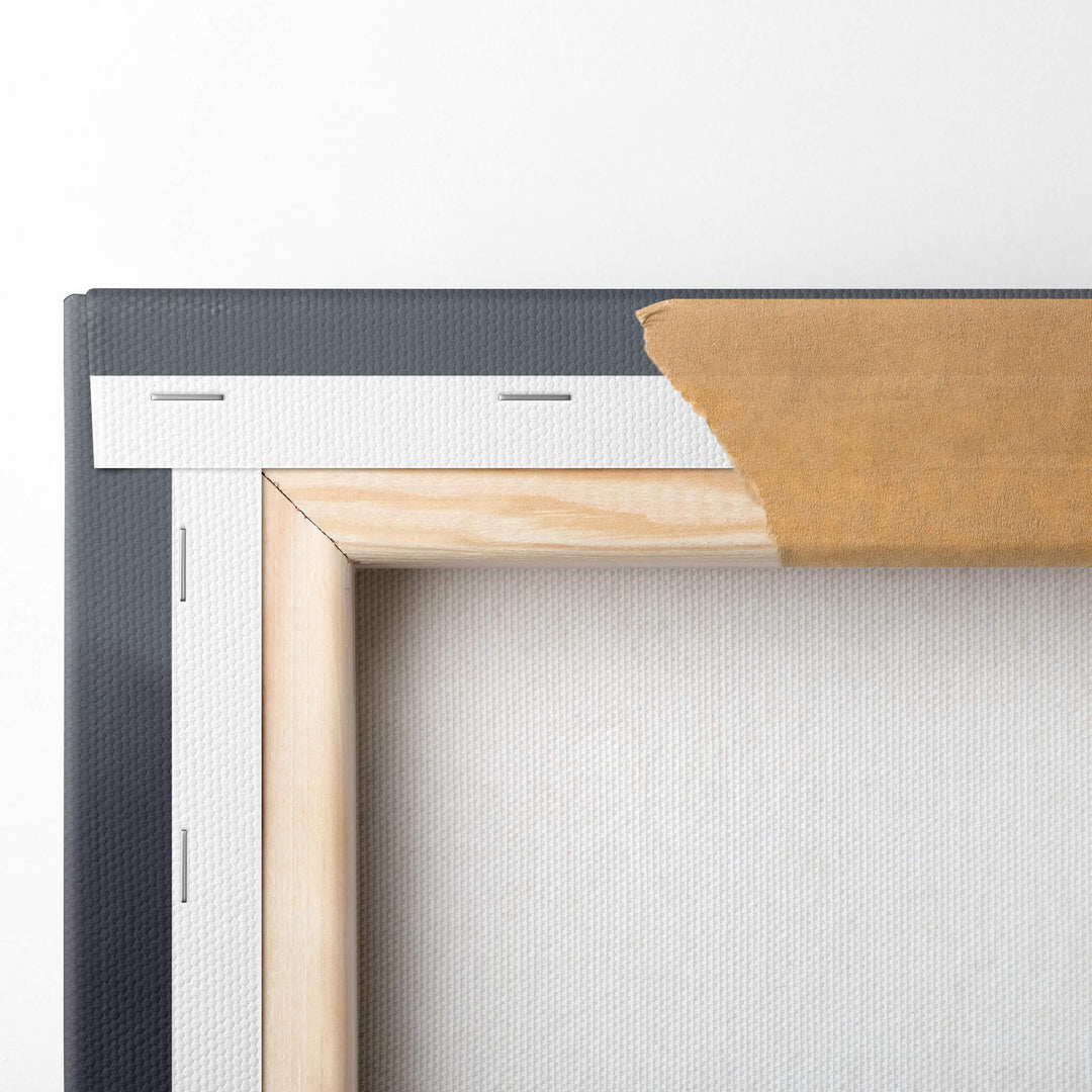 Close-up of the top left corner of a Ferrari canvas print on a 1.5" stretcher bar. The canvas is stretched and stapled.