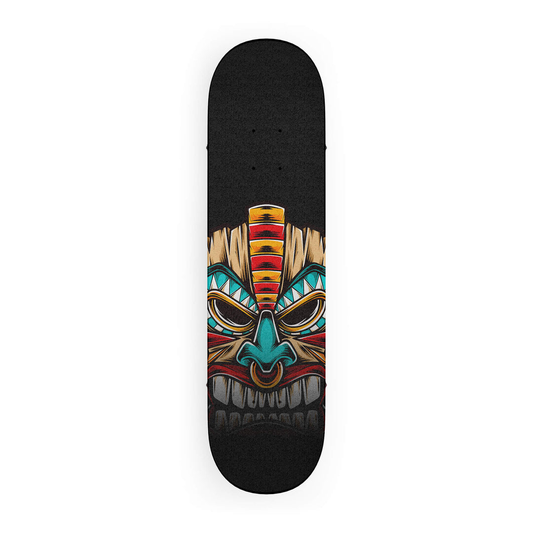 Top-down view of skateboard grip tape featuring a colorful wood tiki mask design with vibrant blues, reds, and brown accents.