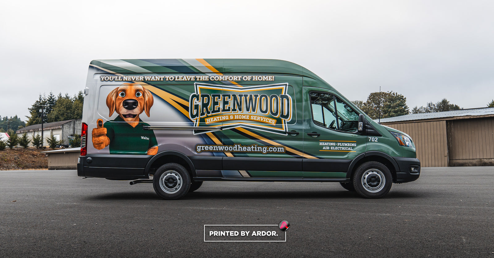 Greenwood Heating & Home Services van with a custom wrap design featuring a dog mascot giving a thumbs-up, alongside the company's logo and website, printed by Ardor.