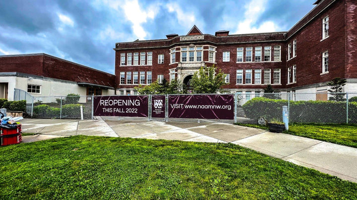 Fence banners for the Northwest African American Museum in Seattle announcing its fall 2022 reopening