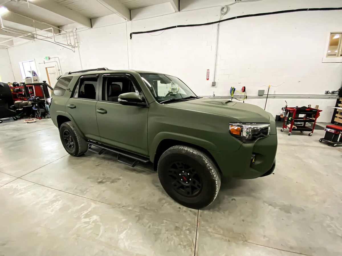 Toyota 4Runner with a matte green vinyl wrap in the Ardor Printing shop, ready for Pacific Northwest weather