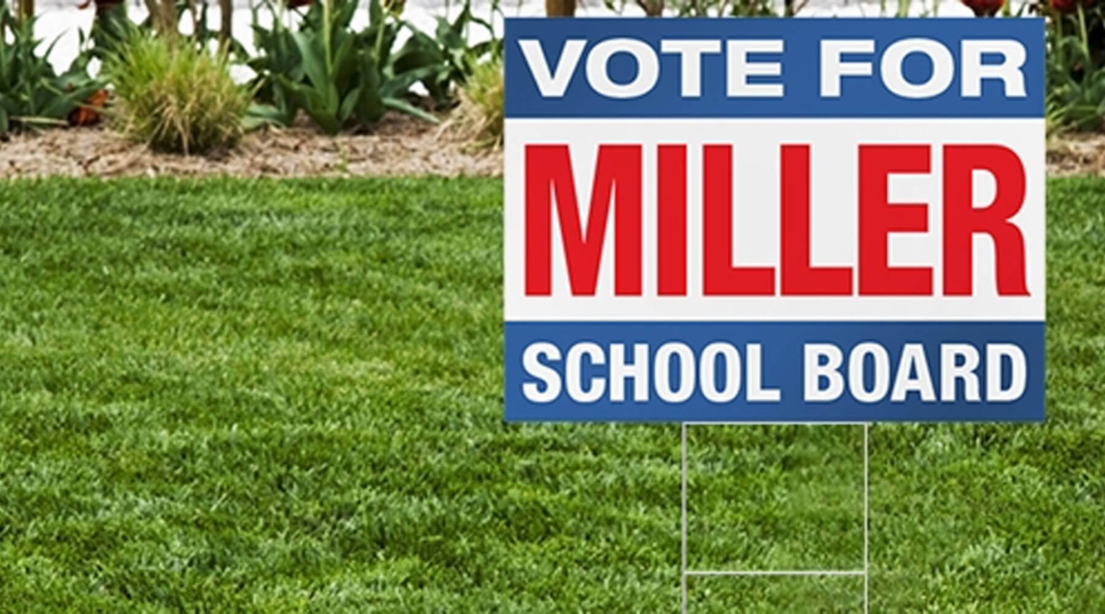 Campaign yard sign reading 'Vote For Miller School Board' displayed on a front lawn