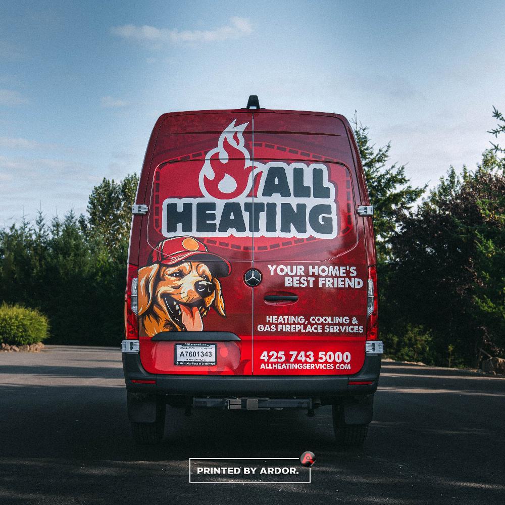 Rear view of All Heating van wrap showcasing company logo, dog mascot, and contact details for heating, cooling, and gas fireplace services.