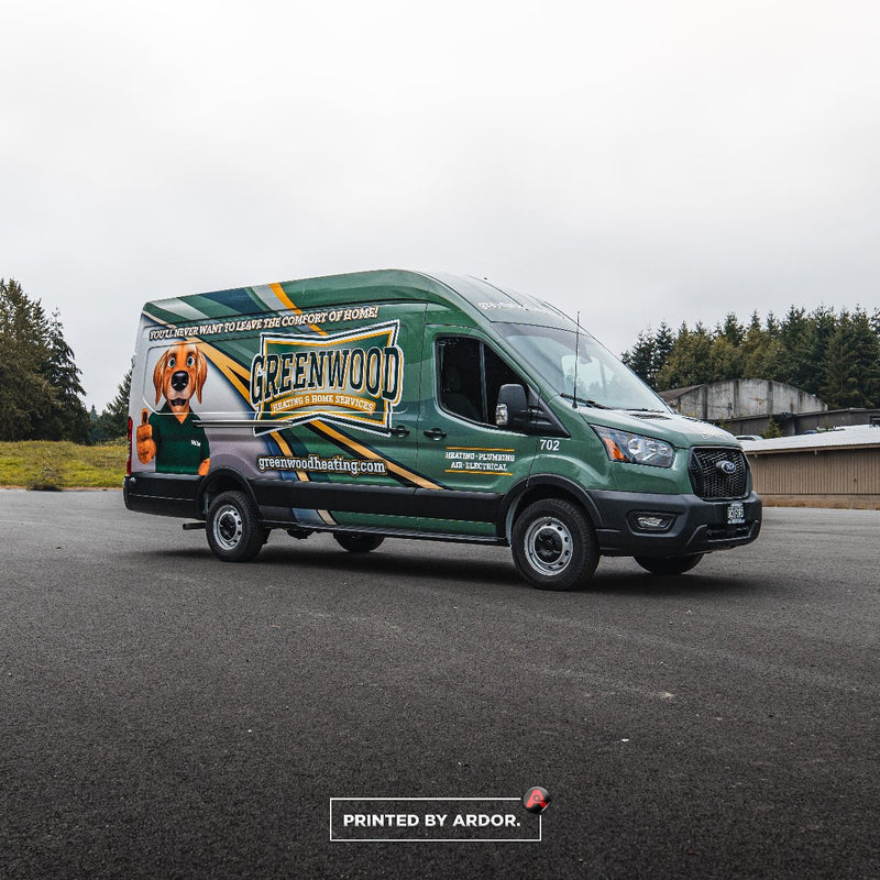 Front passenger side of a Greenwood Heating Ford Transit with a full printed vinyl wrap by Ardor Printing
