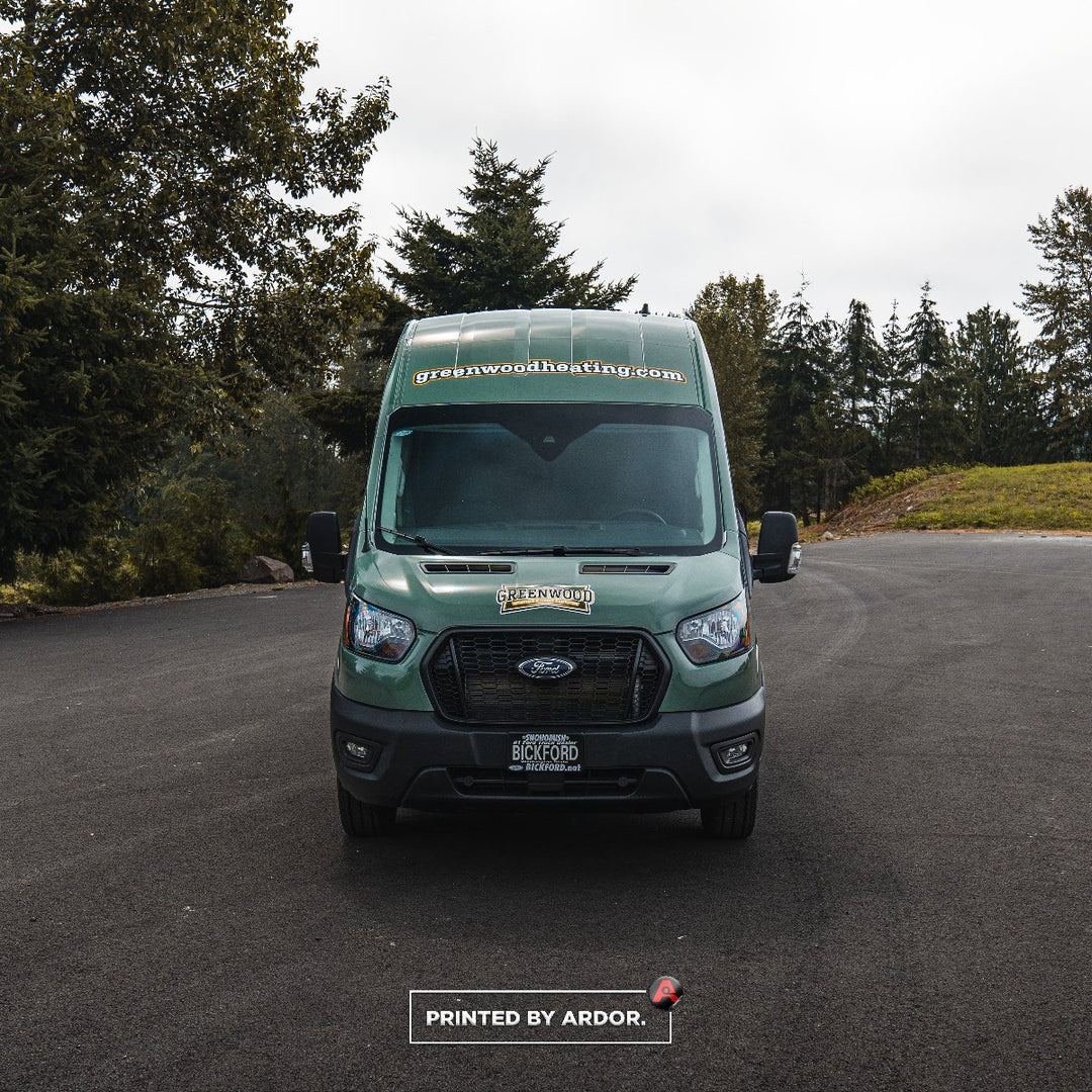 Ford transit with a full vinyl car wrap for Greenwood Heating showing the front of the van in Seattle, WA