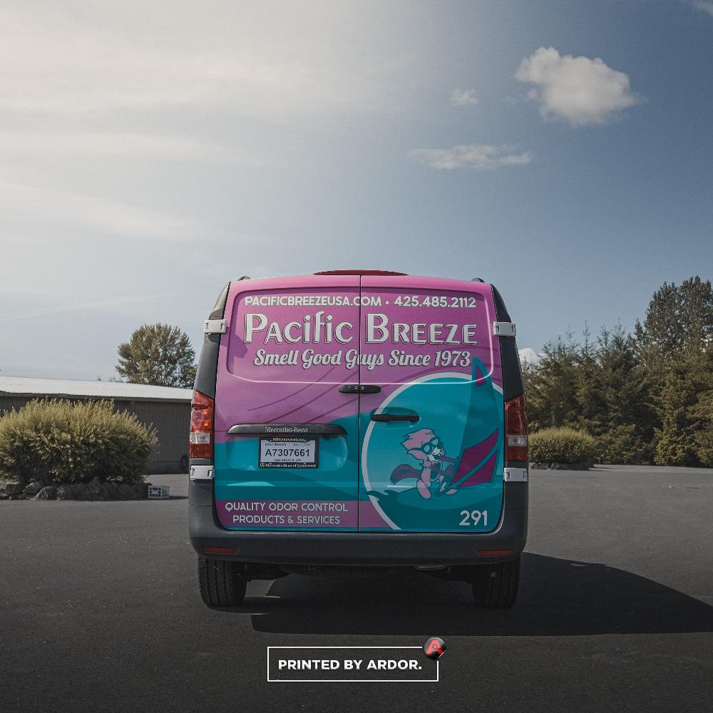 Pacific Breeze van rear wrap featuring bold colors and the company’s 'Smell Good Guys Since 1973' slogan, along with phone and web details.