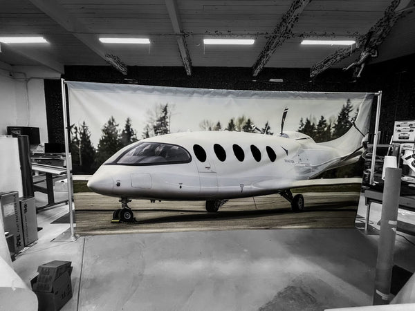 Large photo backdrop banner of an electric aircraft by Ardor Printing