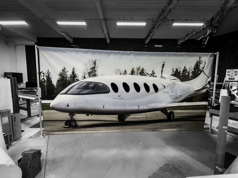 Large photo backdrop banner of an electric aircraft by Ardor Printing