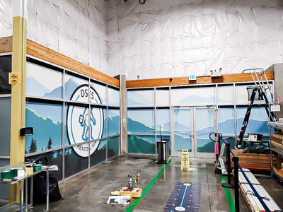 Mountain landscape window graphics covering interior glass at an Amazon delivery station, view 3 by Ardor Printing