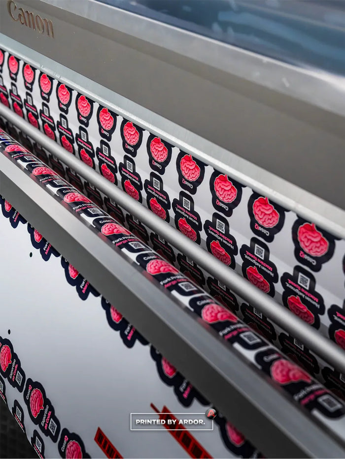CaseIQ brain logo stickers printing on the Canon Colorado at Ardor Printing, a custom sticker printer near Seattle