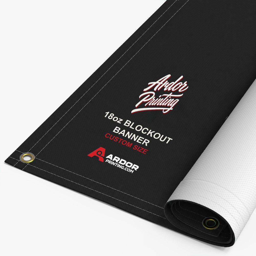 Custom 18oz blockout banner printed with Ardor Printing branding, partly rolled to show the hemmed edge and brass grommets