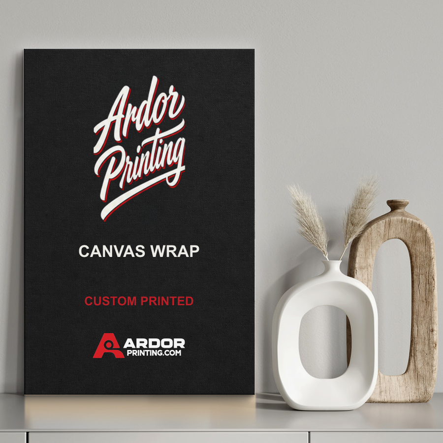 Custom canvas wrap print leaning on a shelf next to a vase