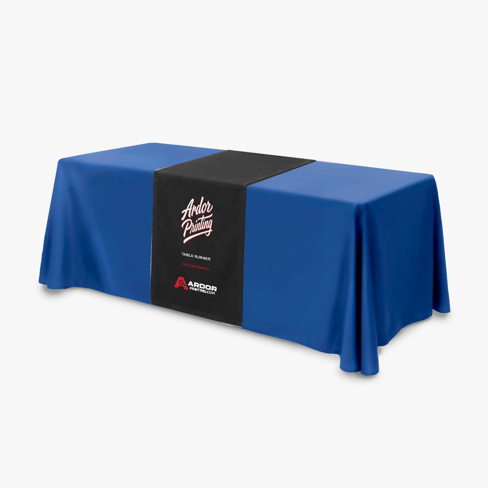 Custom printed table runner with Ardor Printing branding draped over a blue 8 ft solid color table throw