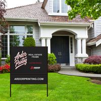 Real estate frame sign with a rider on the front lawn of a house, Ardor Printing branding