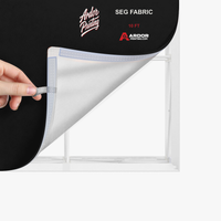 Close-up of the silicone edge fabric graphic being pulled from the 10ft SEG backlit popup display frame, Ardor Printing branding