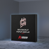 8ft SEG backlit popup display glowing in a dark room, Ardor Printing branding