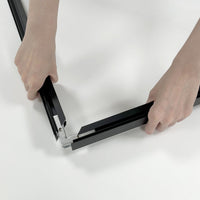 Joining a corner of the black aluminum Wall Mount SEG frame (assembly)