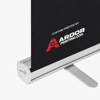 Close-up of the silver standard retractable banner stand base holding the printed graphic, Ardor Printing branding