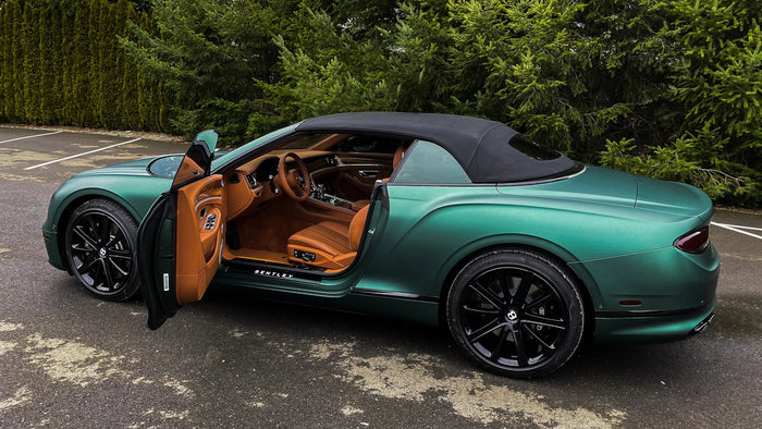 Open door showing wrapped door jambs on a Bentley Continental GT in 3M matte metallic pine green, Ardor Printing