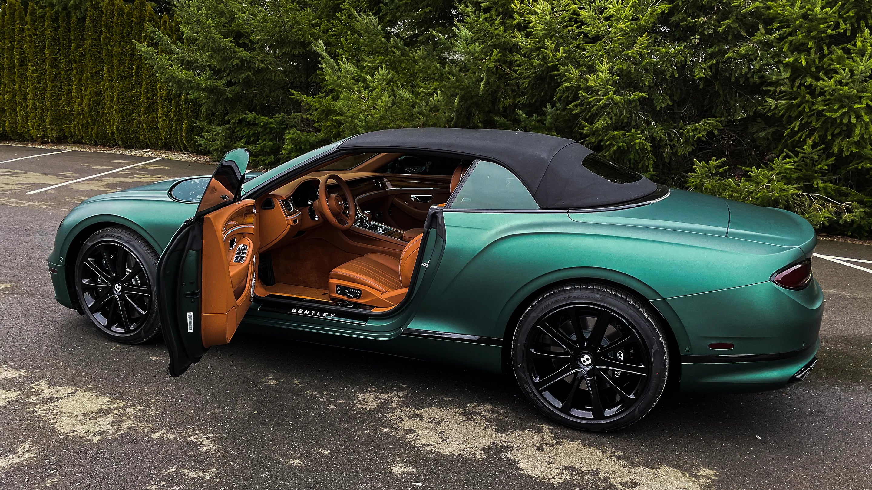 Full car wrap in 3M matte metallic pine green vinyl wrap we installed on this Bentley. We not only wrapped the entire body of the vehicle in car wrap film but also the door jams.