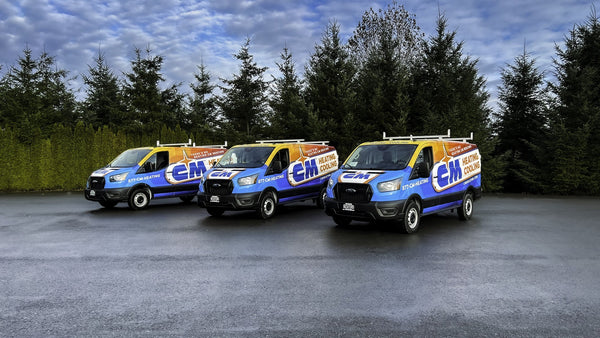 Three CM Heating service vans with matching fleet wraps, printed and installed by Ardor Printing