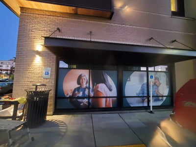 Large lifestyle photo window graphics on a commercial building, view 2 by Ardor Printing