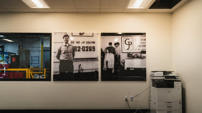 Black and white company history photos printed on acrylic for a plumbing company office by Ardor Printing, view 2