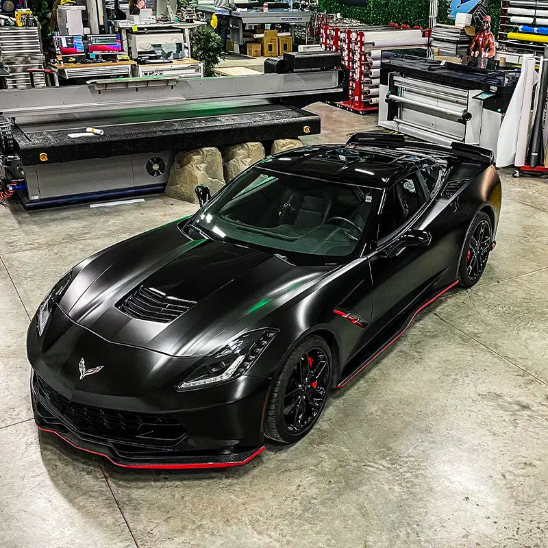 Custom car wrap we did on this new corvette, we wrapped the lower body panels in a satin black wrap film and left the roof and middle section of the hood in gloss black.
