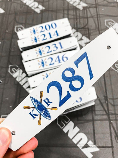 Custom numbered plaques cut on a Zund cutter by Ardor Printing