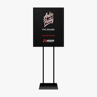 Custom printed PVC board sign shown in a black floor sign stand