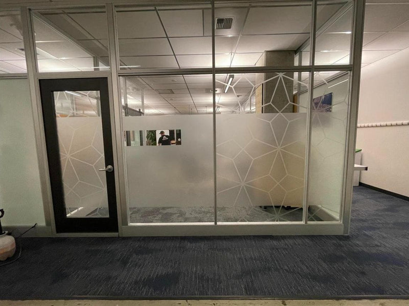 Decorative frosted window film with geometric pattern on office glass walls and doors by Ardor Printing